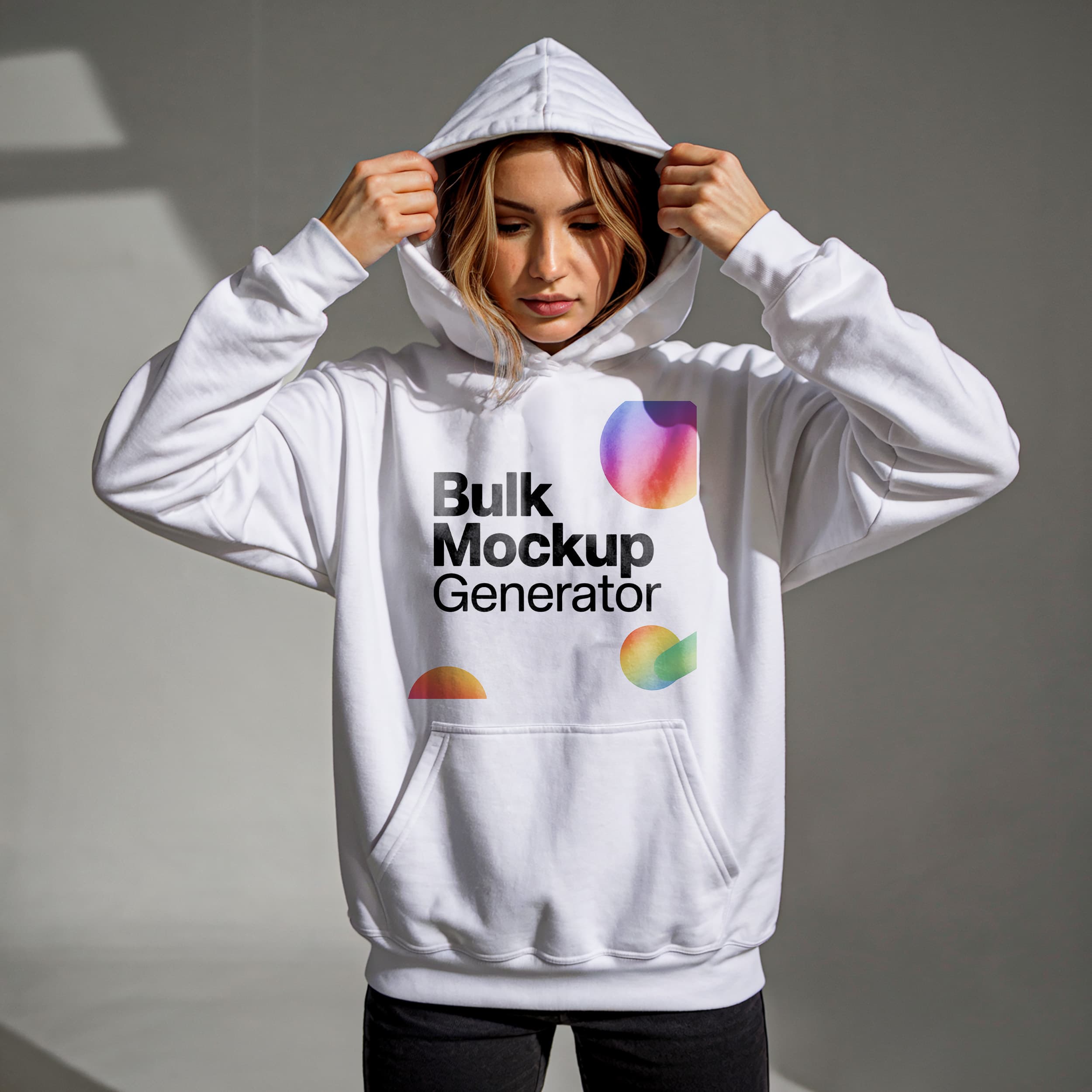 Woman in white hoodie adjusting hood